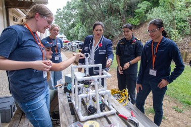 Dame Cindy and a team with their remote-operated-vehicle