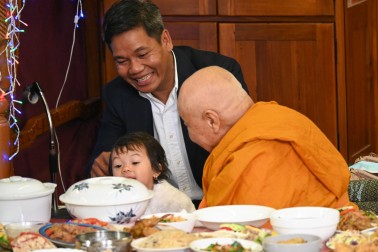 The Senior Venerable Suthep Surapong with one of the youngest members of Wellington's Cambodian community