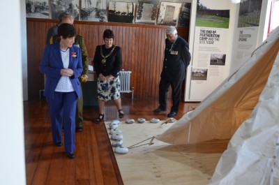The Governor-General, The Rt Hon Dame Patsy Reddy inspecting a display of a soldier's tent.
