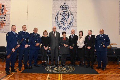an image of Dame Patsy and Sir David with senior police personnel and college instructors