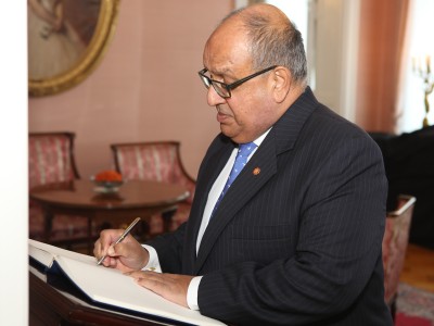 Signing the visitor book.